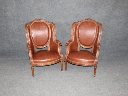 Vintage Louis XVI Style Faux Leather Wingback Chairs: A Pair of Upholstered Armchairs